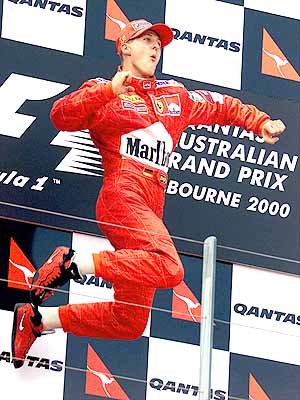M. Schumacher jumps for joy on the podium.