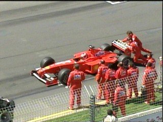 M. Schumacher stalls his car at the start and has to be pushed