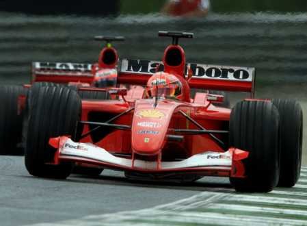 The two Ferrari swap places with a few metres to go to the end of the GP