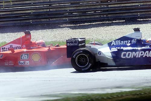 M. Schumacher and Montoya touch and both drop back several positions