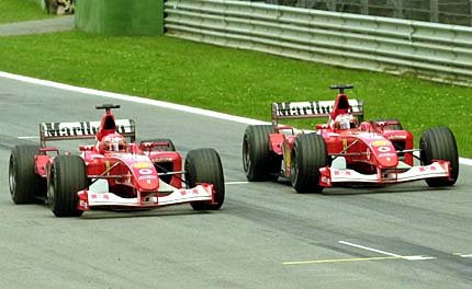 Barrichello lets M. Schumacher through just before the finishing line.