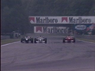 Hakkinen takes advantage of M. Schumacher trying to overtake Zonta and goes ahead.