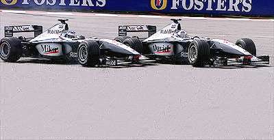 Coulthard and Hakkinen come together at the first corner