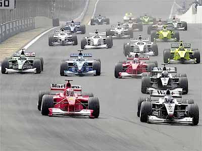 2000 Brazilian Grand Prix. Interlagos, Sao Paulo, Brazil. 24-26 March 2000.  Michael Schumacher (Ferrari), David Coulthard (McLaren Mercedes) and  Giancarlo Fisichella (Benetton Playlife) with footballer Pele and Ferrari  Technical Director Ross Brawn (