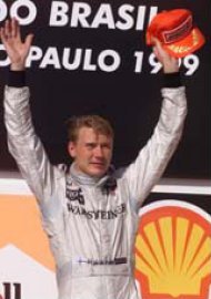 Hakkinen salutes the crowd from the podium