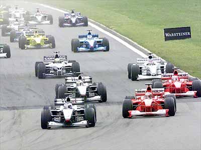 The start. Hakkinen slices through Coulthard and m. Schumacher.