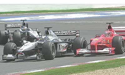 Coulthard goes for it and takes the lead from M. Schumacher