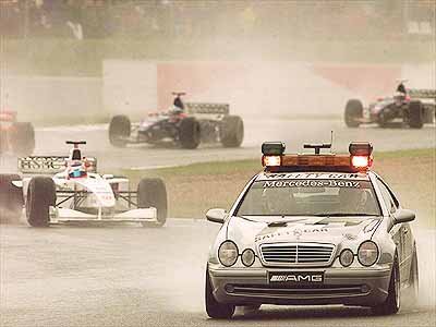 The safety car comes out because of the heavy rain.