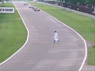 A disgruntled Mercedes ex-employee runs across the track.