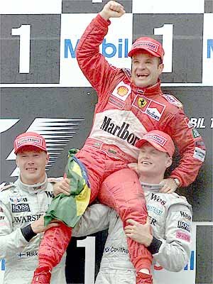 The podium. Barrichello is overjoyed by his maiden victory