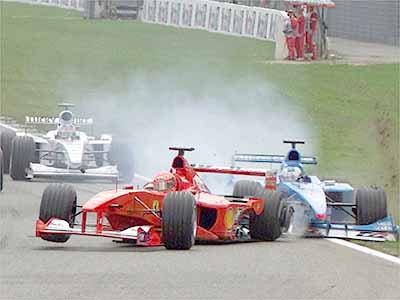 The start. Fisichella hits M. Schumacher and both retire.