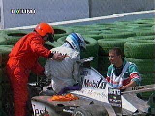 Hakkinen is helped out of his car after his crash