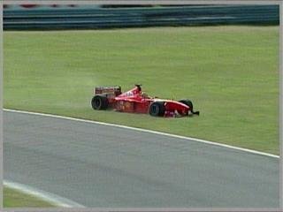 Irvine goes on the grass and gives second position to Coulthard.