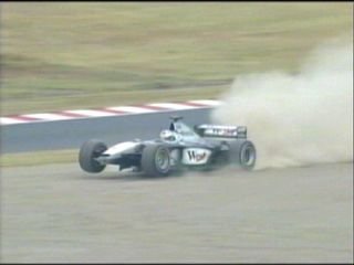 Coulthard spins and damages his nosecone.