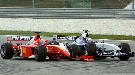 The start. M. Schumacher and Montoya touch. M. Schumacher loses his front wing.