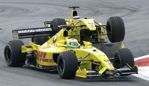 Sato hits team mate Fisichella from behind.