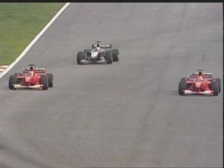 Hakkinen knows of his penalty and lets the two Ferrari through.