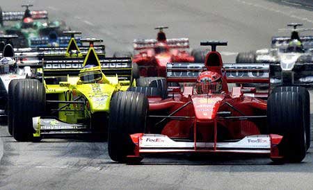 The start. M. Schumacher takes the lead while Trulli blocks the rest of the pack.