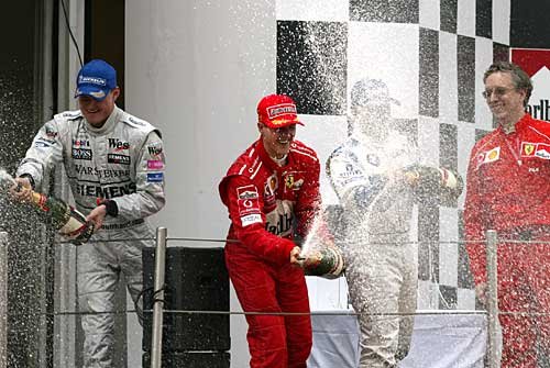 The podium: M. Schumacher, Montoya, Coulthard.