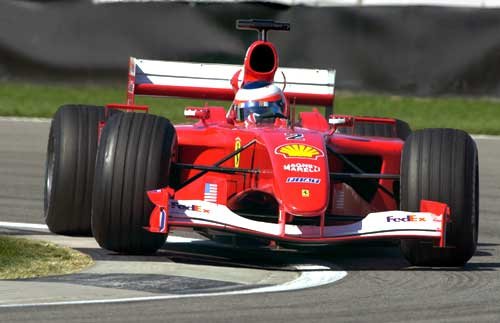 Barrichello takes the lead from M. Schumacher and leaves the pack behind
